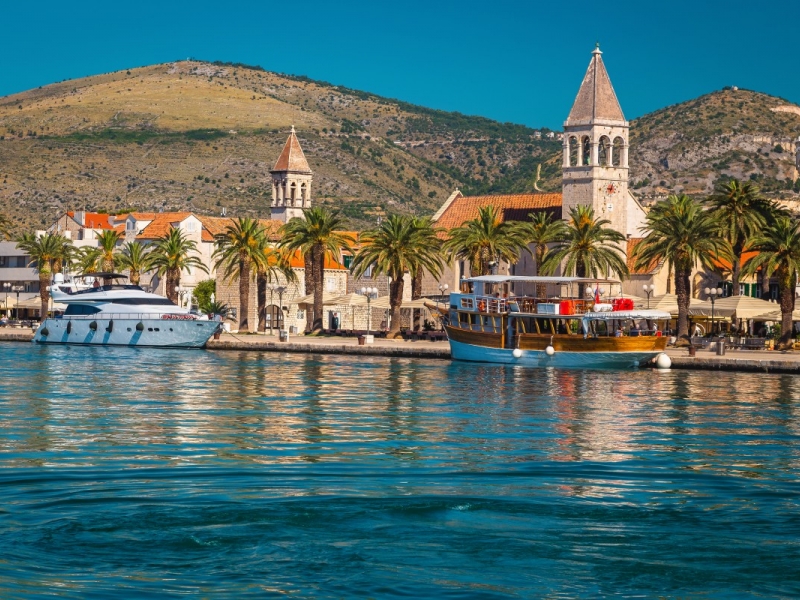 Spectacular waterfront promenade with palm trees and street cafes in trogir  velika, Motorcycle Rental Agency Trogir Croatia